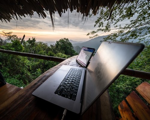 Man working from home in Colombia typing on a modern laptop
